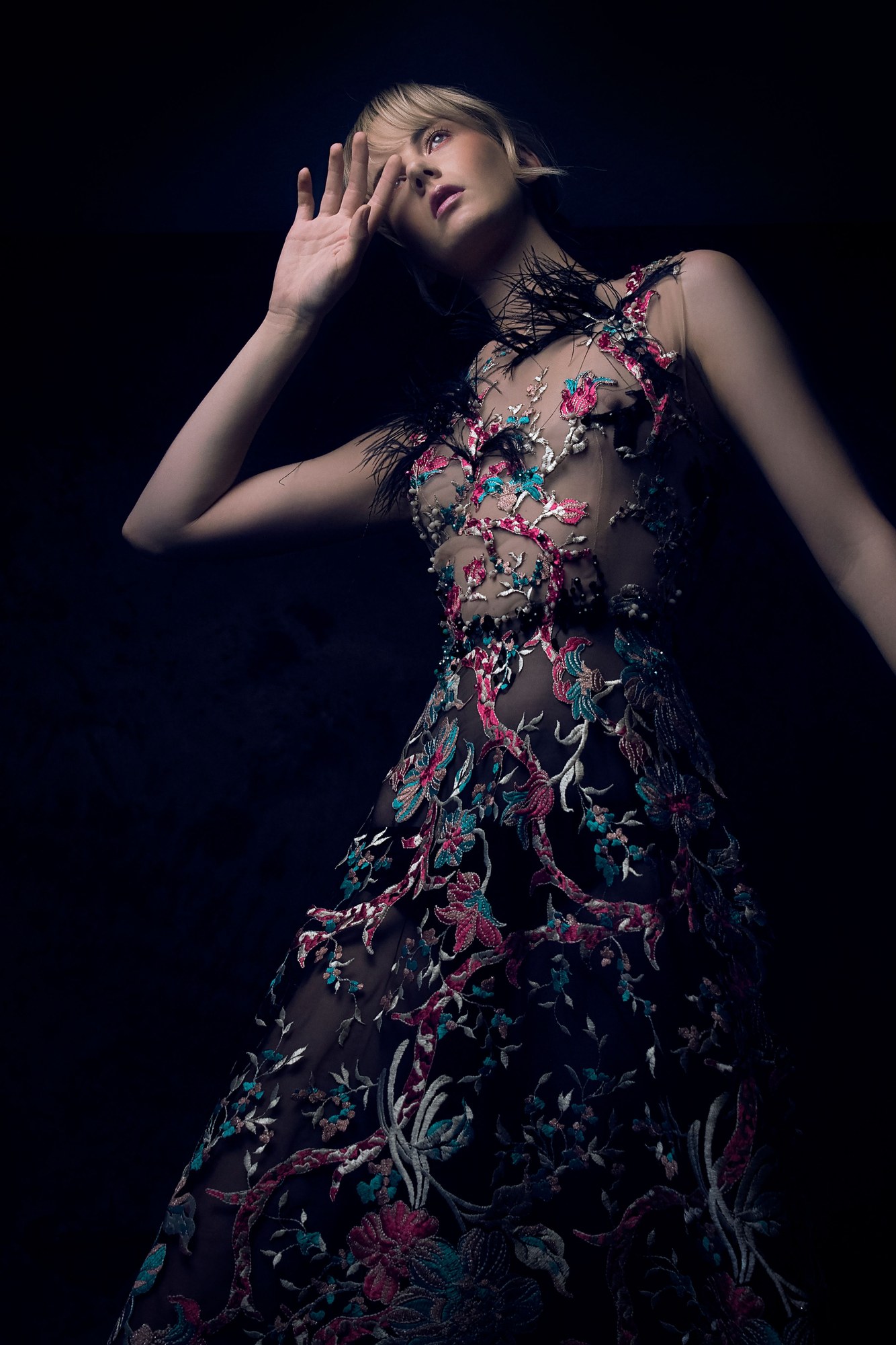 Couture fashion portrait in dramatic studio light