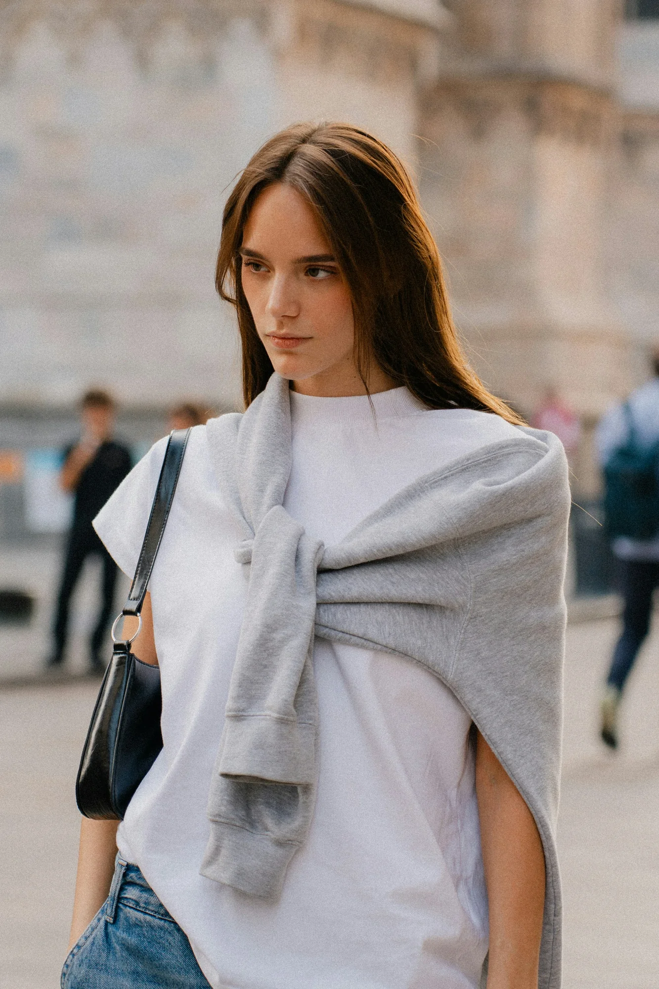 Milan street-style portrait in a white T-shirt with soft grey layering