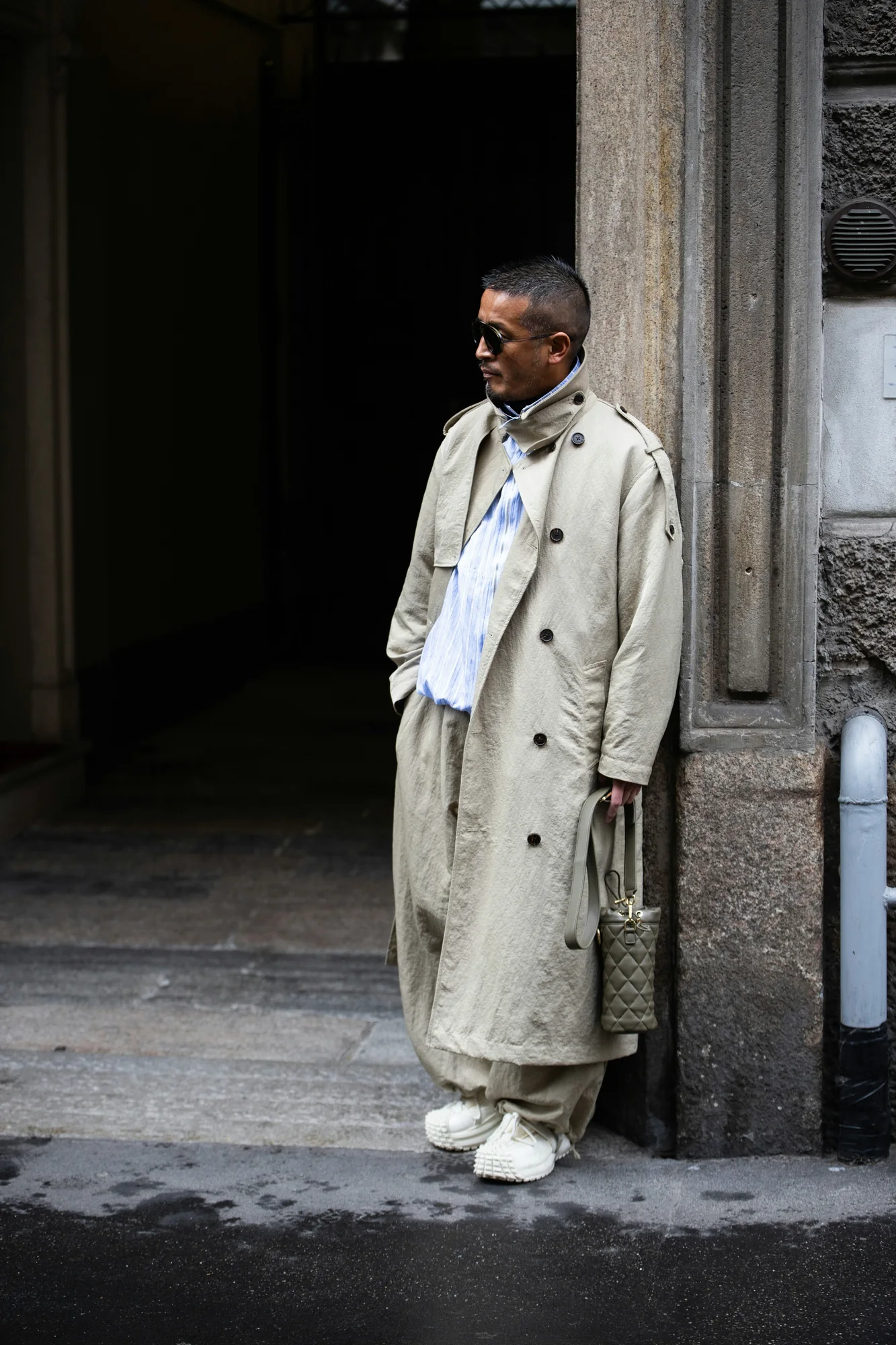Milan street-style portrait in a neutral trench coat