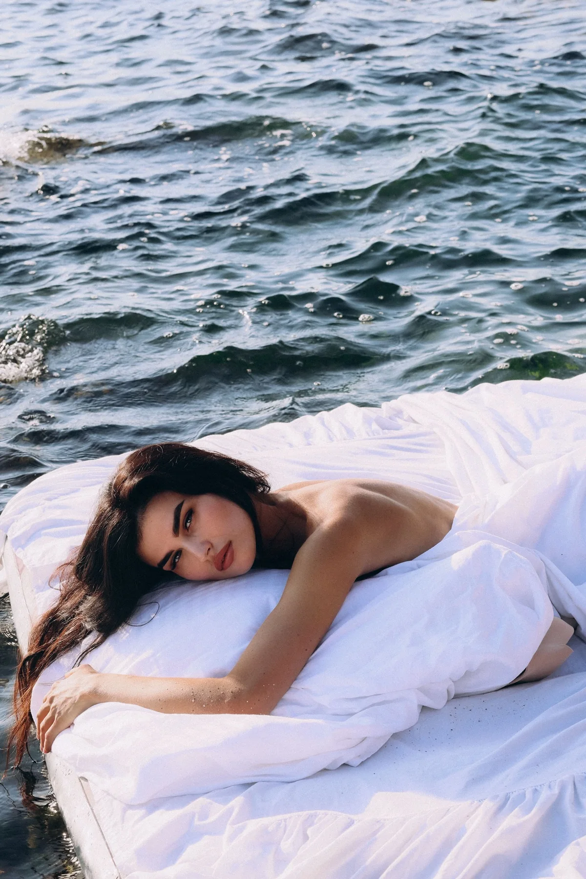 Luxury resort fashion editorial beside the water